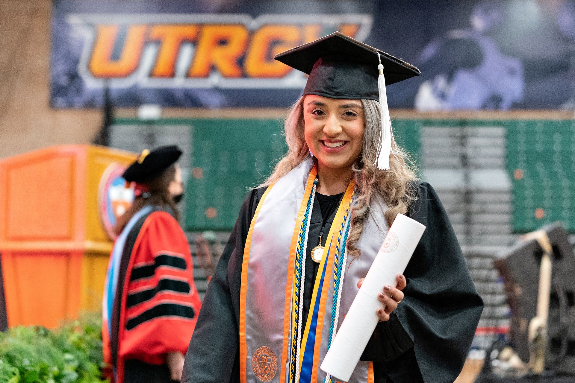 Female student in graduation gown Female student in graduation gown