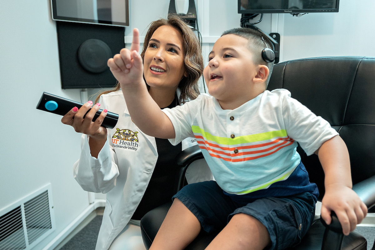 Physician assisting child. Physician assisting child.