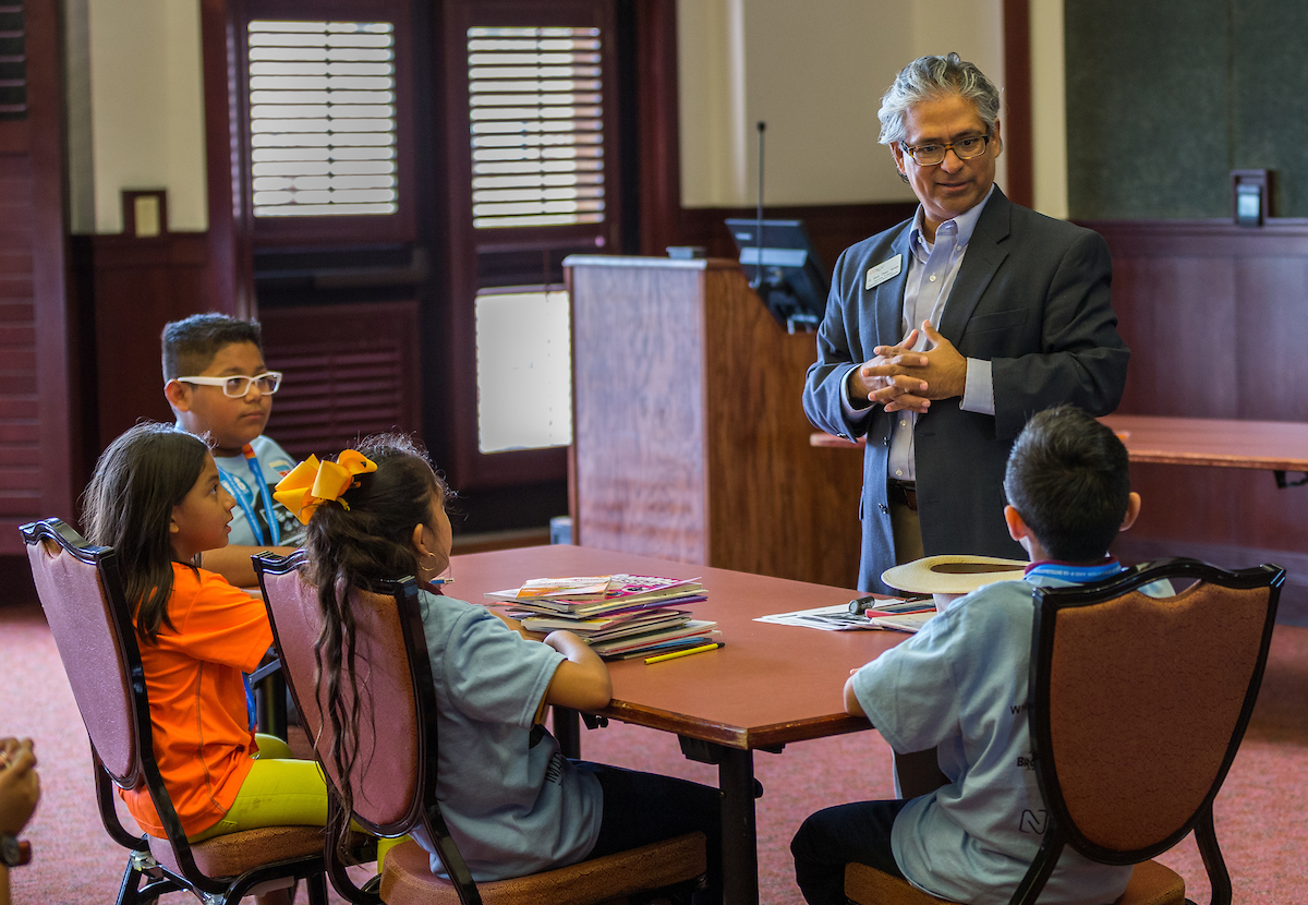 Professor teaching young students 