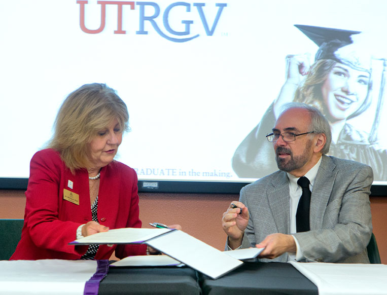STC President Shirley Reed and UTRGV President Guy Bailey Signing document