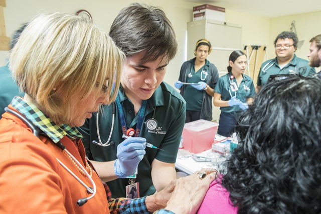 UTRGV’s first-year medical students recently traveled to the Indian Hills community near Mercedes to administer flu shots for the first time and work with patients.