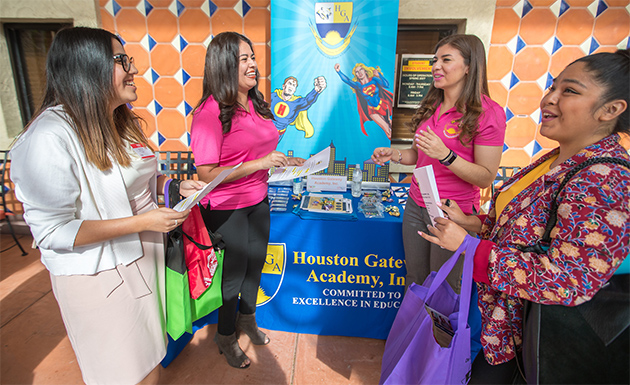 Recruiters from 58 school districts across Texas participated in UTRGV’s Spring Teacher Jobs Expo on the Brownsville campus on Thursday, April 6, in the hopes of hiring some of the university’s upcoming education graduates. Pictured are two recruiters from Houston Gateway Academy, Yessica Cano (center left) and Kenya Mendoza (center right), both December 2015 UTRGV graduates, talking with expo attendees. The expo continues Friday, April 7, on the UTRGV Edinburg Campus. (UTRGV Photo by Veronica Gaona)