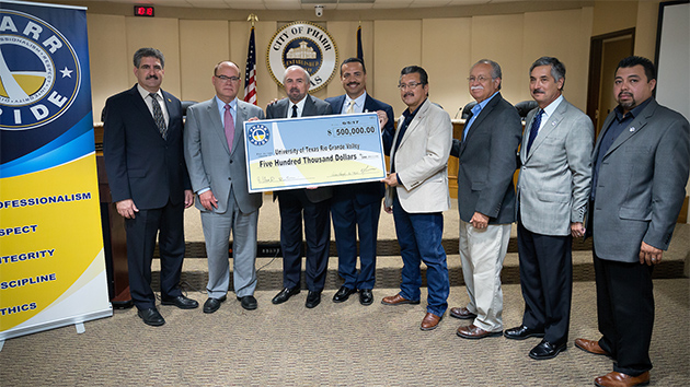 Pictured, from left to right, are Dr. Steven Lieberman, interim dean of the UTRGV School of Medicine; Dr. John H. Krouse, incoming dean of the UTRGV School of Medicine; UTRGV President Guy Bailey; City of Pharr Mayor Dr. Ambrosio Hernandez, and City of Pharr Commissioners Eleazar Guajardo, Ricardo Medina, Ramiro Caballero and Daniel Chavez. UTRGV Photo by Paul Chouy.