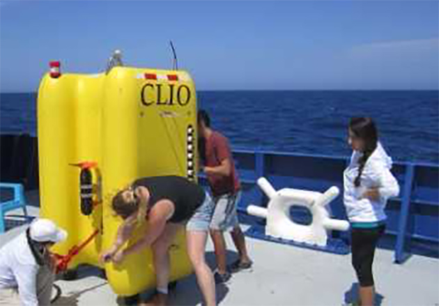 Researchers and students aboard the Research Vessel Neil Armstrong prepare CLIO – the world’s first unmonitored underwater vehicle designed completely for studying the microbiology and biochemistry of the ocean – for underwater testing, where it will filter water for microorganisms. (Courtesy Photo)