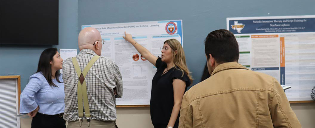 Woman presenting information from poster