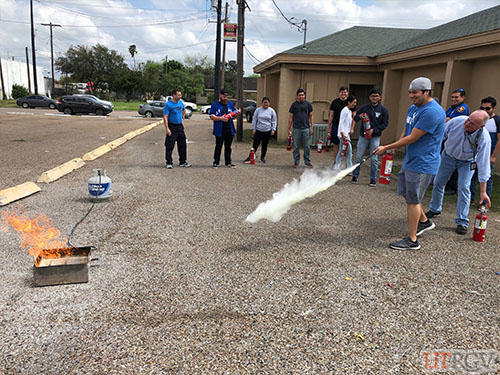 Practicing with a Fire Extinguisher during Evacuation Assistant/Fire Extinguisher Training, February 26, 2019.