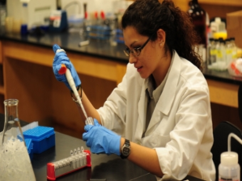 College of Sciences - UTRGV student with micropipette