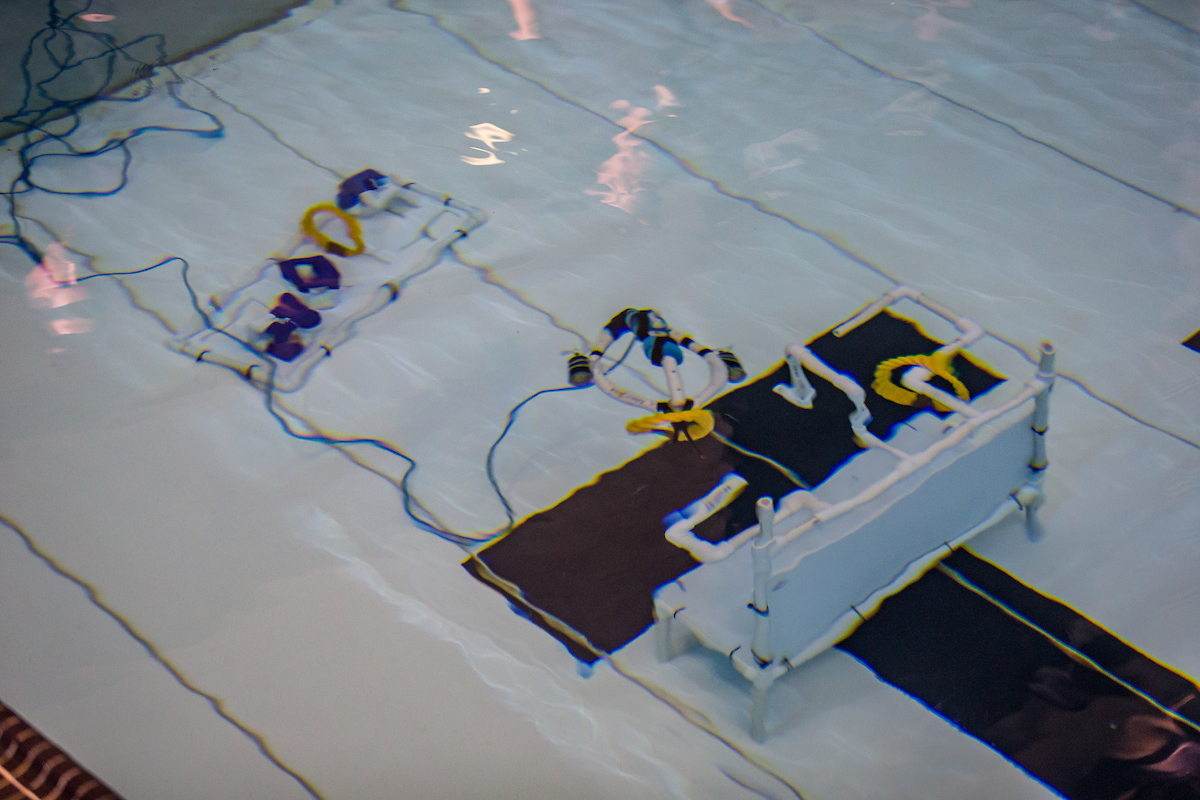 Underwater robot makes its way through course.