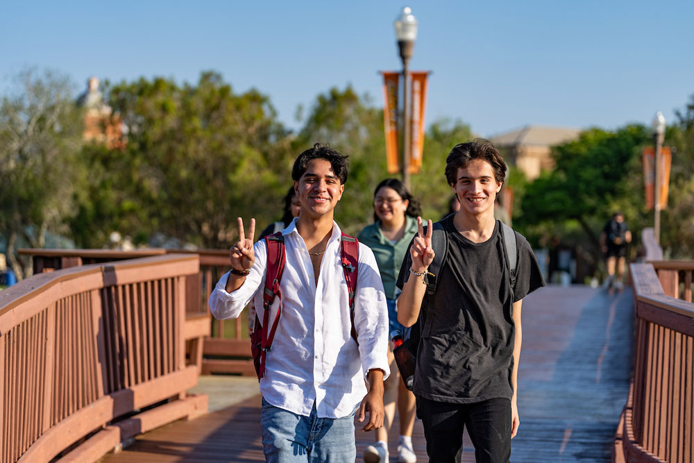 students walking through Brownsville campus