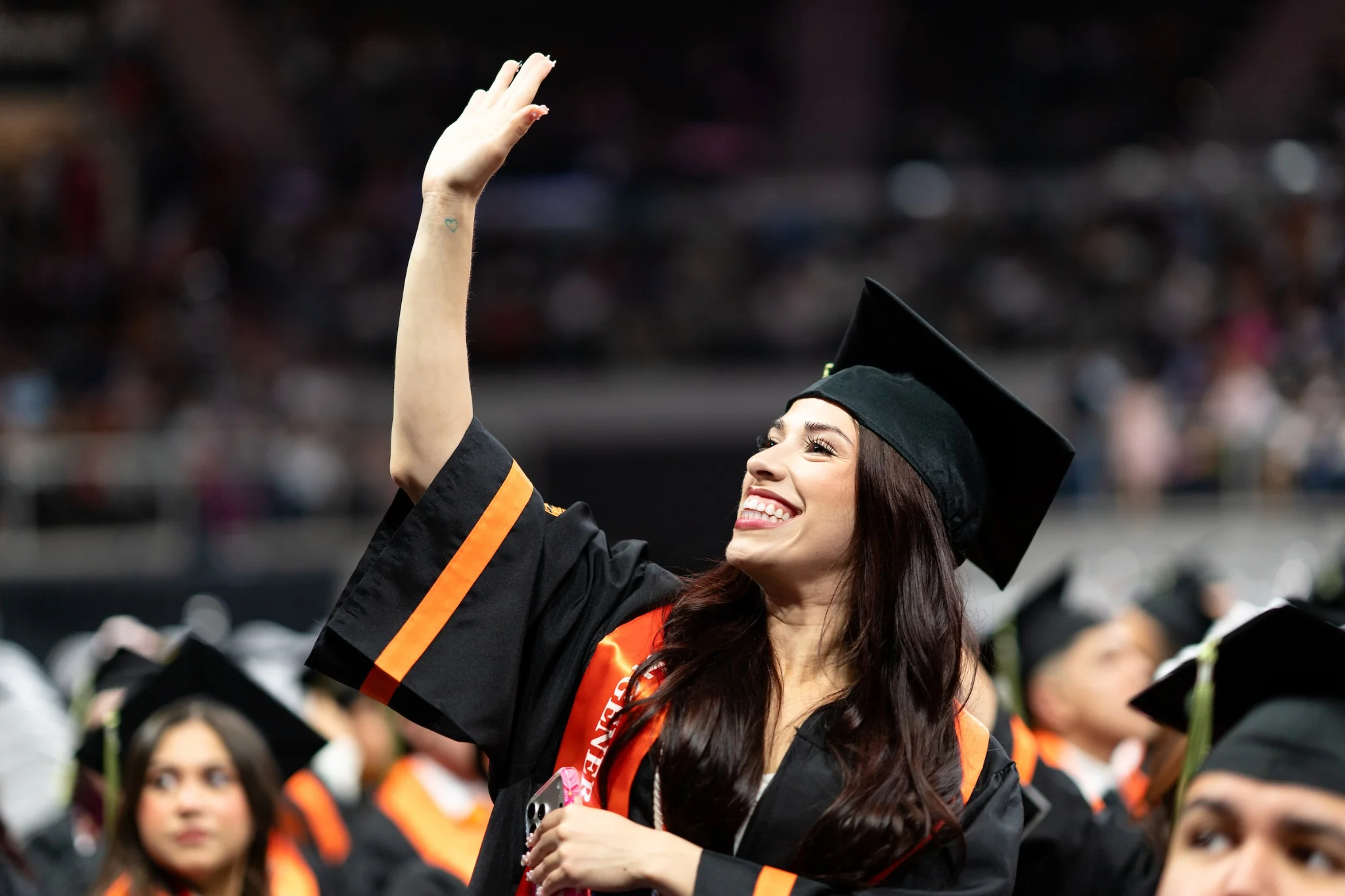 UTRGV graduate celebrating during commencement ceremony