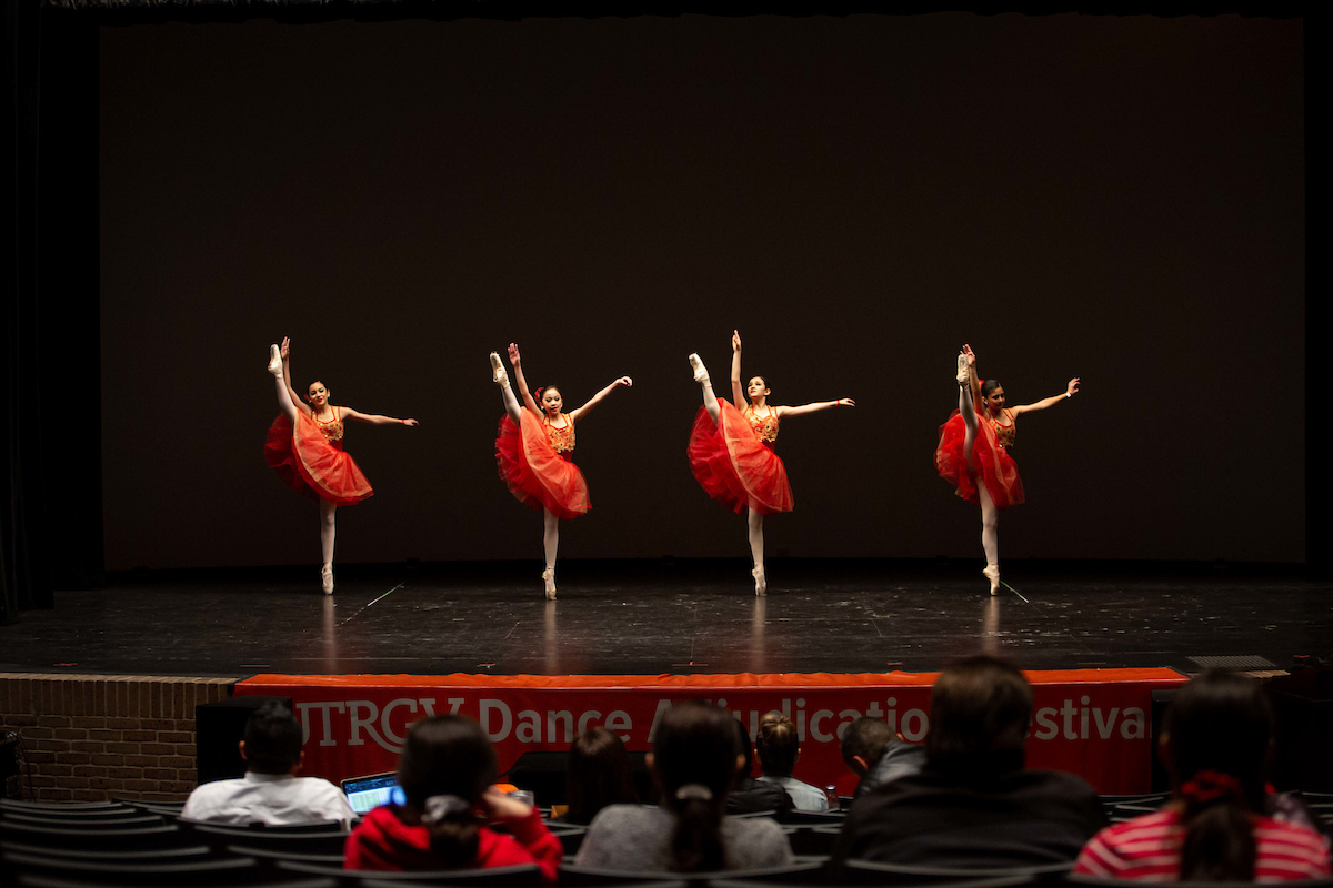 Dancers performing a ballet on stage