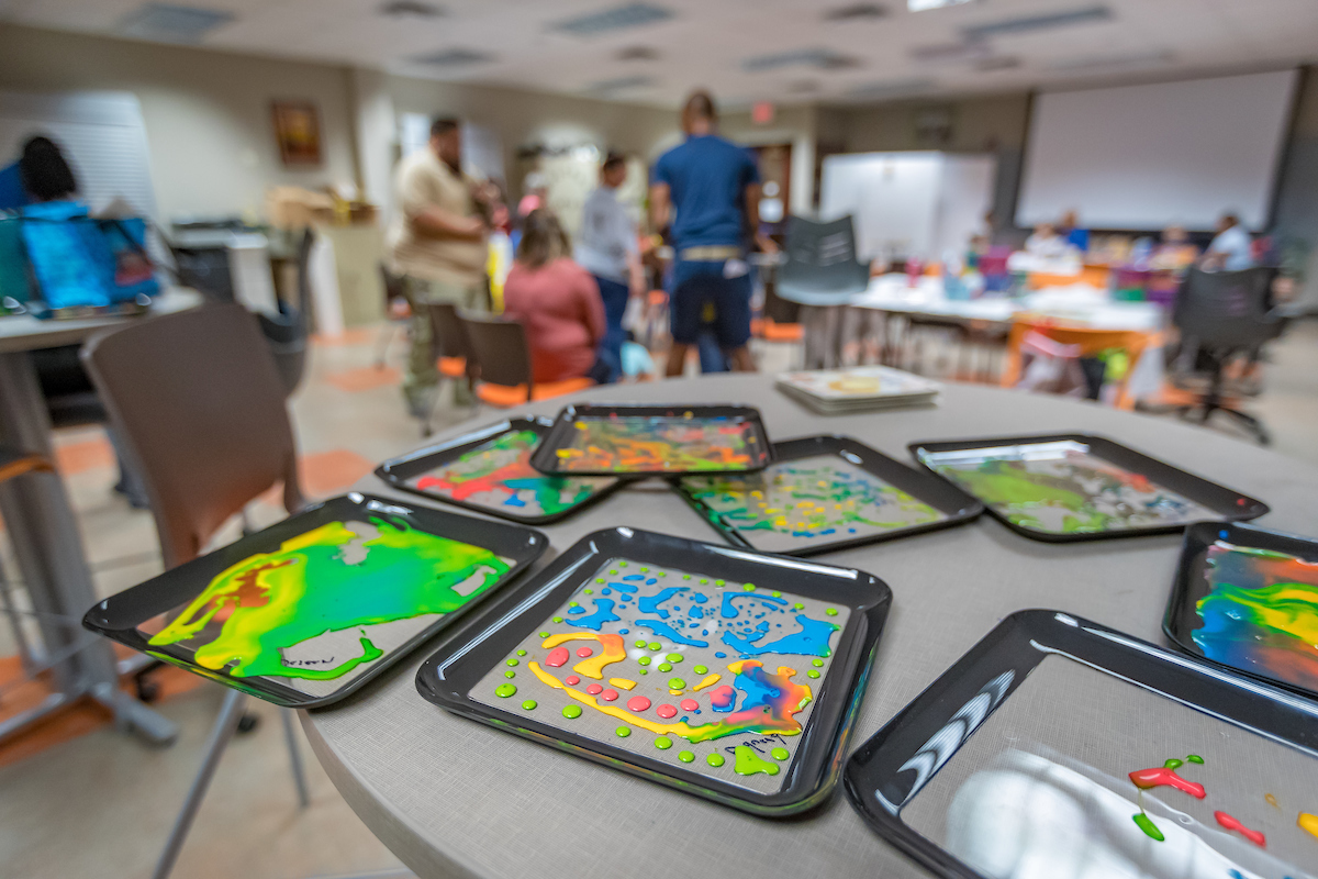 Play trays on a desk during a camp for special needs kids