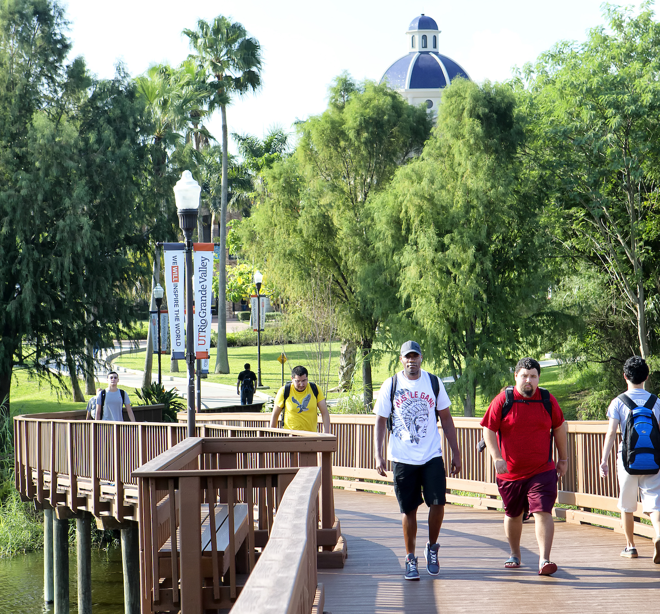 Students walking on bridge on Brownsville campus