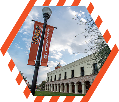 light pole with flags saying UTRGV Get Your Orange On 