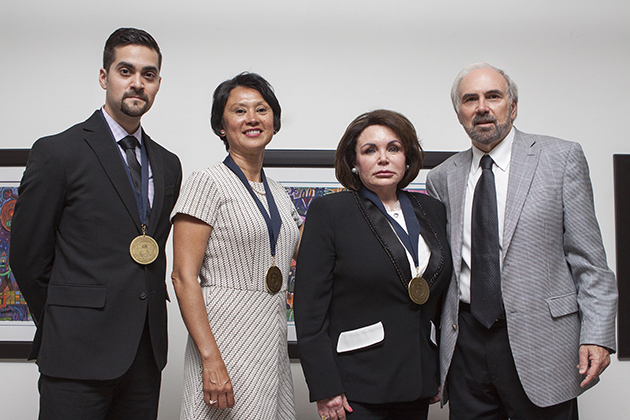 The University of Texas Rio Grande Valley recognized its first group of Distinguished Alumni in a special ceremony and reception May 13, 2016, at the Brownsville Museum of Fine Art. Here (from left), honorees Heriberto Reynoso, Alicia Margarita Torres and Lauryn Gayle White pose at the reception with UTRGV President Guy Bailey after receiving their awards. The fourth honoree, Michael Mancias, was unable to attend the event but sent a videotaped message. (UTRGV Photo by Veronica Gaona)