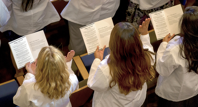The UTRGV School of Medicine’s Class of 2020 participated Saturday, July 23, 2016, in the traditional White Coat Ceremony, where each new medical student donned the short white coat for the first time. Right after the cloaking, students took the Hippocratic Oath, shown here. (UTRGV Photo by David Pike)