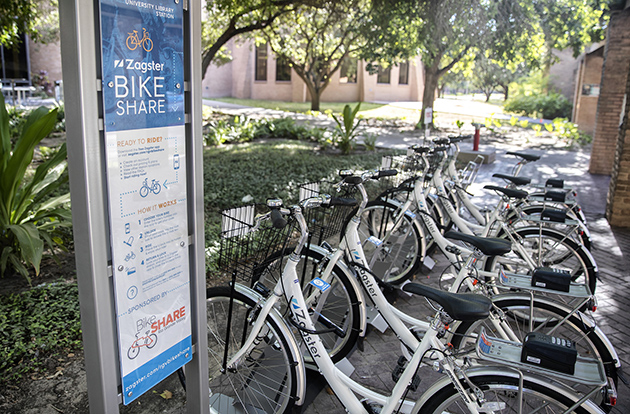 BikeShare Rio Grande Valley, a program proposed by four UTRGV students in a class taught by Dr. Elizabeth Heise on shared and alternative transportation models, is managed by Zagster and makes available to students, faculty, staff and the public 85 cruiser bikes found at stations on the Brownsville, Edinburg and Harlingen campuses. Stations also are available at various locations in Brownsville and Harlingen that have partnered with the university to offer this service. The station shown here is on the UTRGV Edinburg Campus. (UTRGV Photo by David Pike)