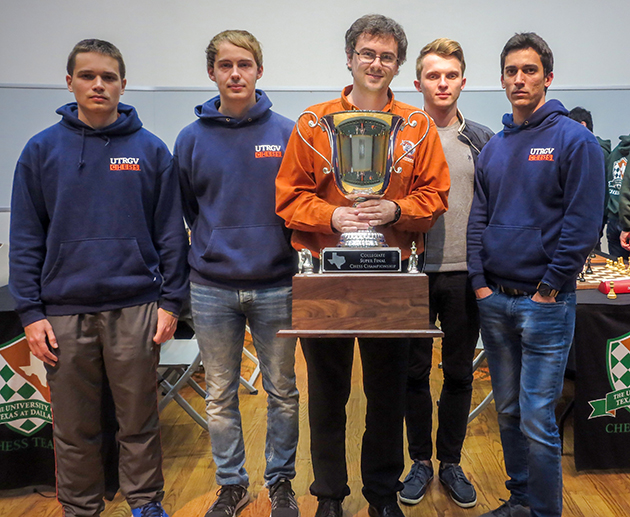 UTRGV Chess Coach Bartek Macieja, center, holds the 2016 Texas Collegiate Super Finals trophy, with Team A members, from left: Grandmaster Anton Kovalyov, senior computer science major from Canada; Grandmaster Andrey Stukopin, junior physics major from Russia; Grandmaster Vladimir Belous, freshman finance major from Ukraine; and Grandmaster Carlos Hevia, freshman computer science major from Cuba. (UT Dallas Courtesy Photo by James Stallings)