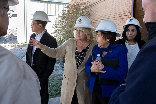 Officials from UTRGV and the Pharr-San Juan-Alamo school district on Feb. 15 celebrated the launch of the future site of PSJA’s Early Head Start campus on Fir Street in Pharr. The former Buckner Elementary School is about 60 years old and undergoing renovation. Here, Deborah Daniels (at center), a child care program specialist with Region V1 of the Administration for Children and Families, Office of Child Care, speaks with Dr. Hilda Medrano, a UTRGV professor in the College of Education and P-16 Integration, and principal investigator and director of the Early Head Start grant. (UTRGV Photo by Paul Chouy)