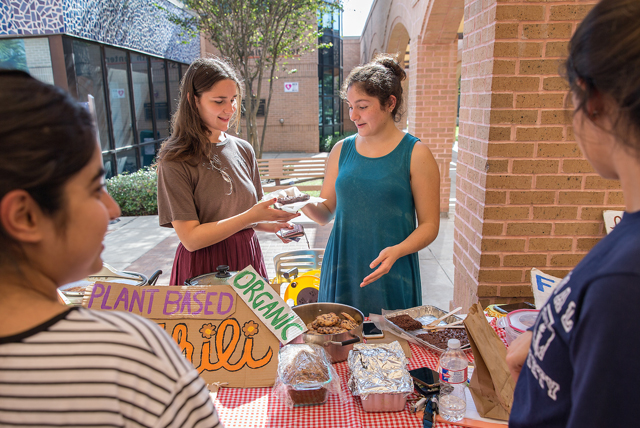 Suzanne El-Haj (at left) and Martha Garcia, co-presidents of the UTRGV Environmental Awareness Club, spearhead the monthly UTRGV Farmers Market, open to students and the public alike and held outside the Recreation Center on the Edinburg Campus. All produce sold at the farmer’s market is certified organic, and the focus is on promoting healthier eating habits. (UTRGV Photo by Paul Chouy)