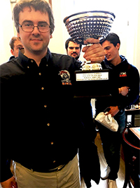 UTRGV Chess Coach GM Bartek Macieja proudly displays the President’s Cup trophy, awarded to the UTRGV Chess Team as the 2018 National Champions of the Final Four of College Chess competition. The tournament was held March 31-April 1 at the Marshall Chess Club in New York City. (Courtesy Photo)