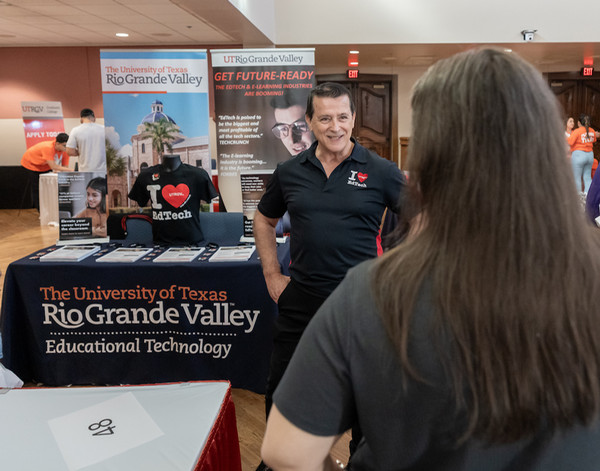 UTRGV program faculty talking to student