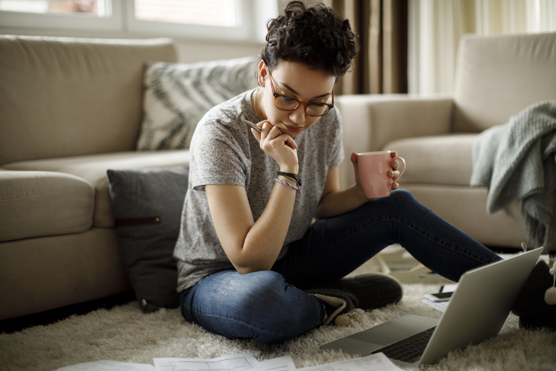 Relaxed student looking at a laptop