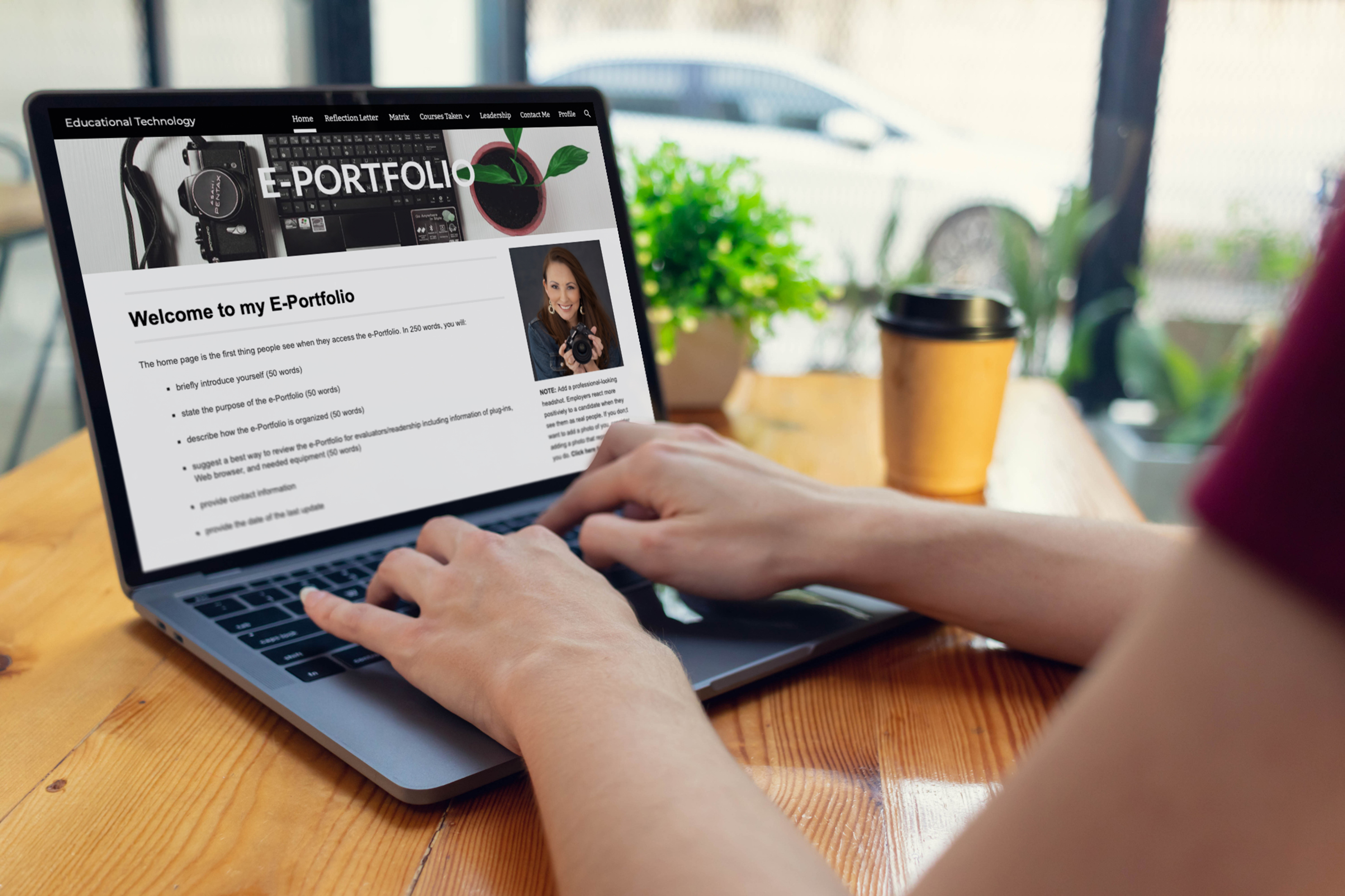 Person using a laptop displaying an Educational Technology e-portfolio.