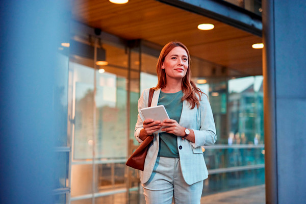 business woman in an office with a tablet 