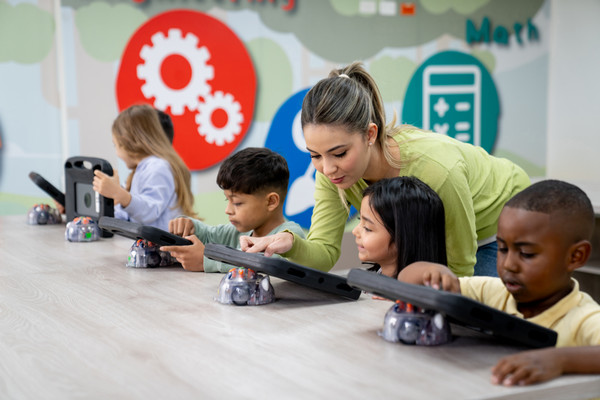 Students in a classroom working on tablets 