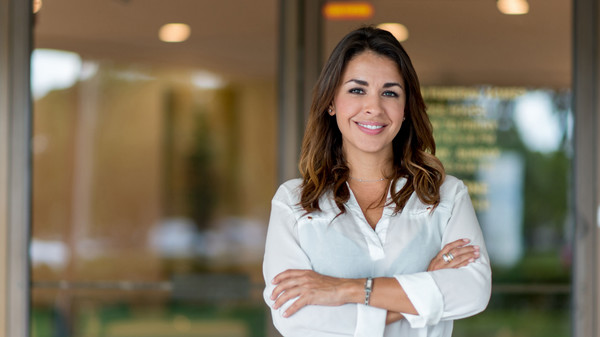 A professional woman smiling at the camera