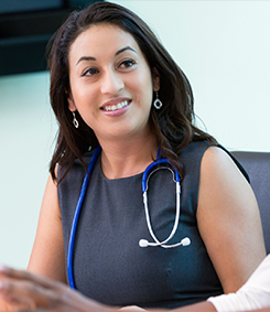 Student smiling with stethoscope around her neck