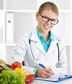 Health sciences medical student smiles while writing on a clip board