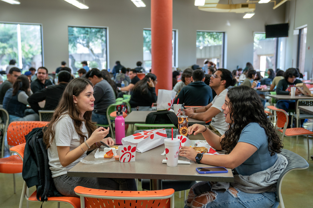 Students eating in the cafeteria.