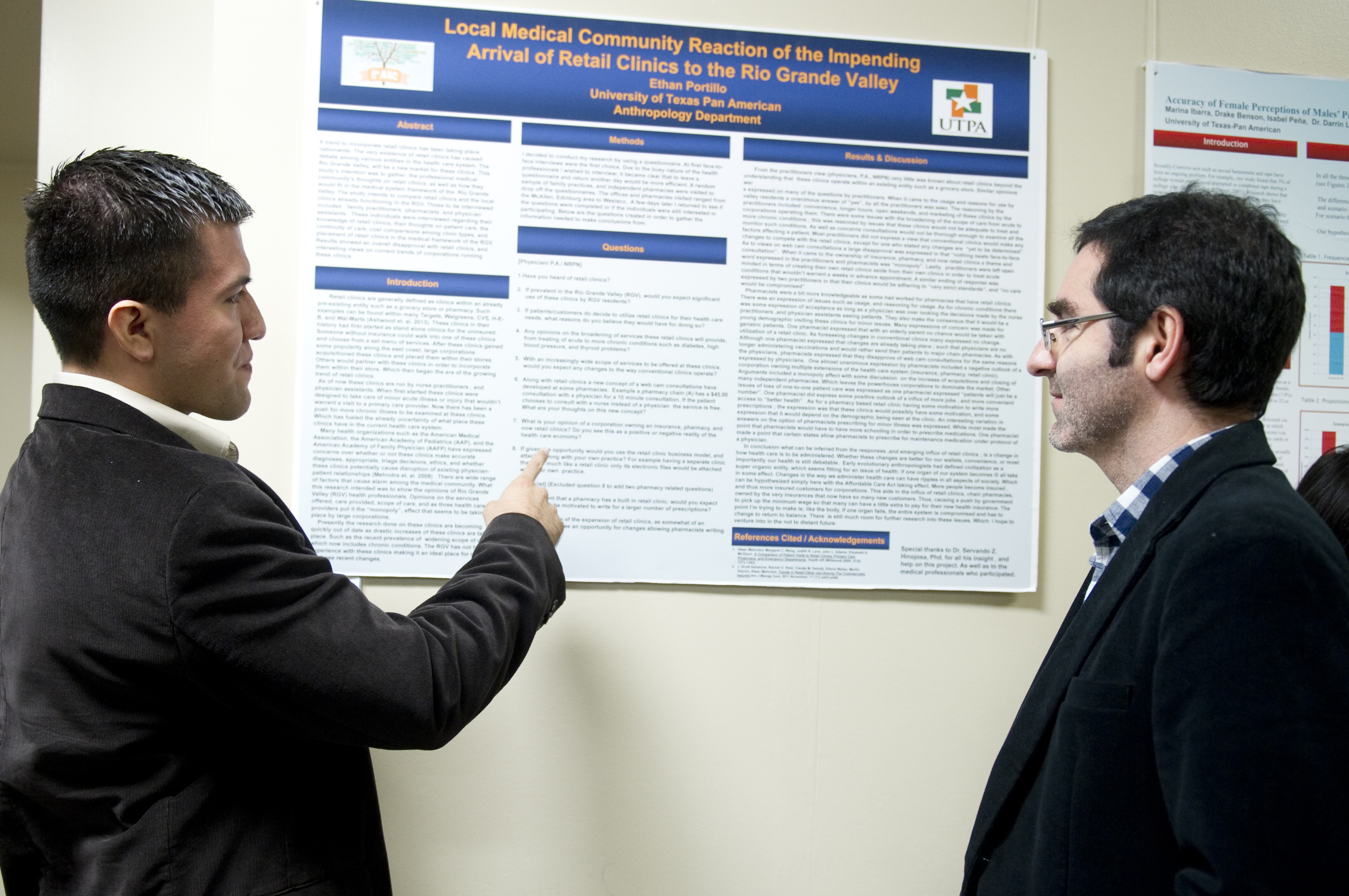 Anthropology undergrad Ethan Portillo presenting a research poster at an SBS Research Conference in 2014 with Dr. Servando Hinojosa