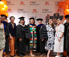 Group of B3 scholars standing celebrating their graduation