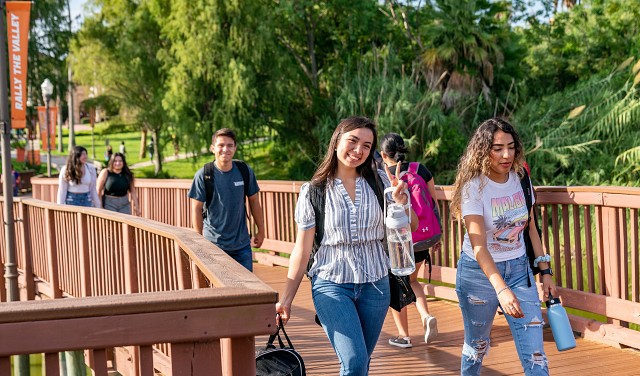 UTRGV students walking across Brownsville bridge.