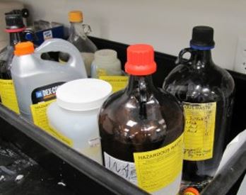 labeled hazardous material stored in containers