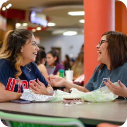 Two UTRGV students eating at the Student Union food court