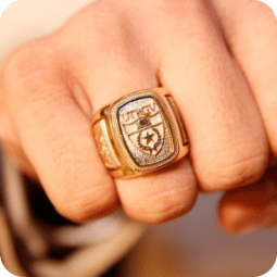 Persons hand wearing the official UTRGV ring