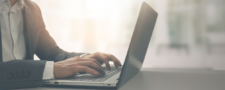 Employee typing on a computer