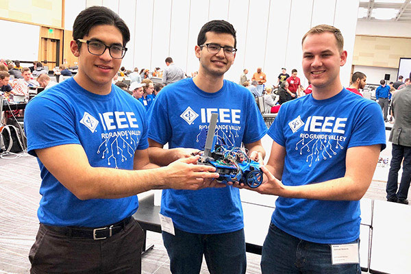 Group of students showing their robotic car