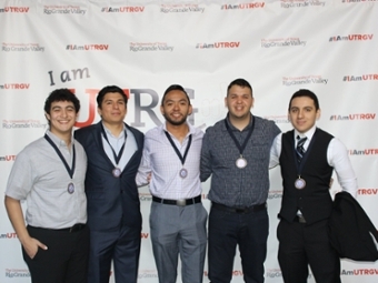 Group of engineering students posing for a photo at an awards ceremony.