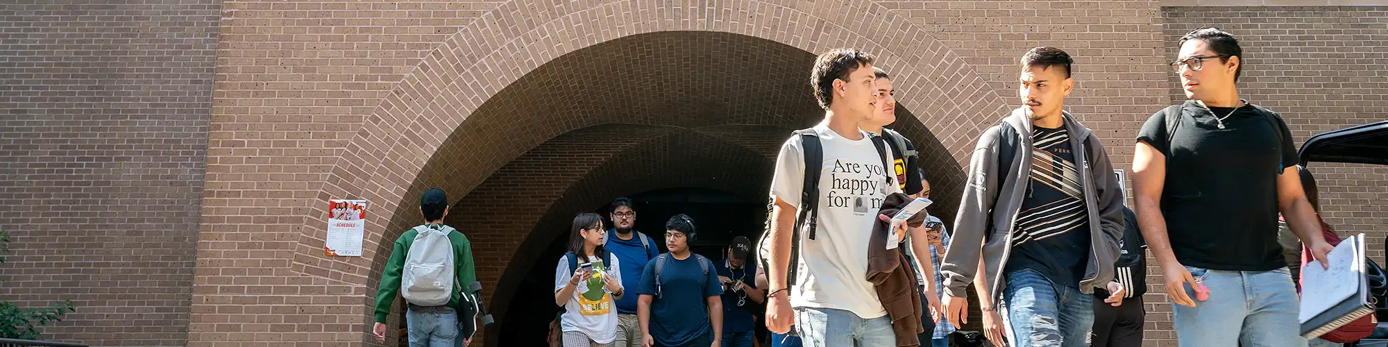 Group of students walking in front of engineering building.