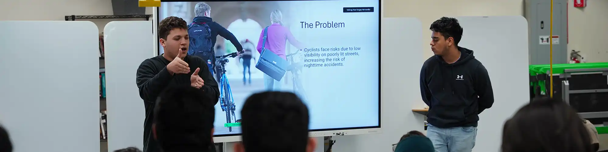 Group of students presenting a project in class.