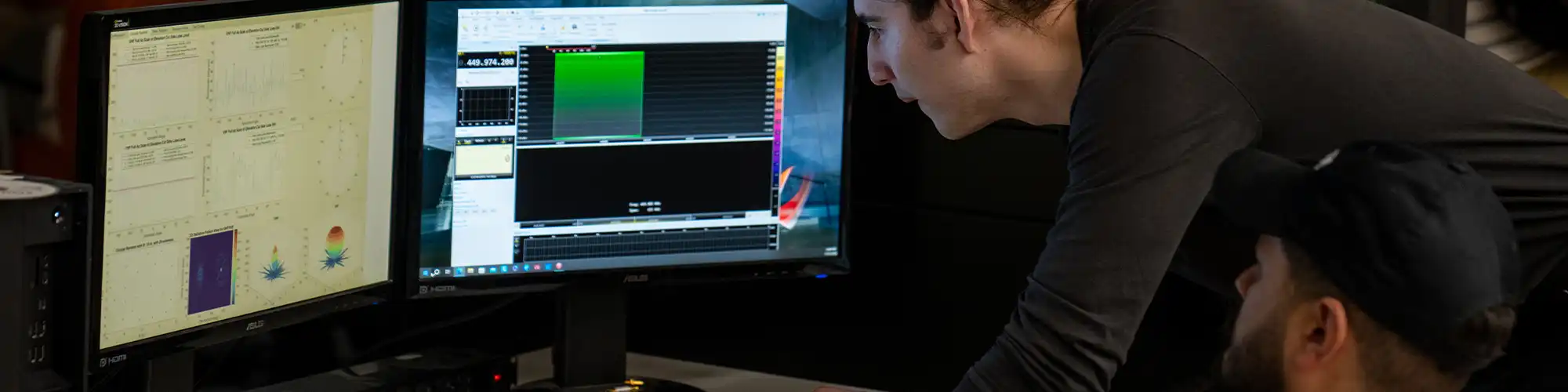 Two students working on a single computer.