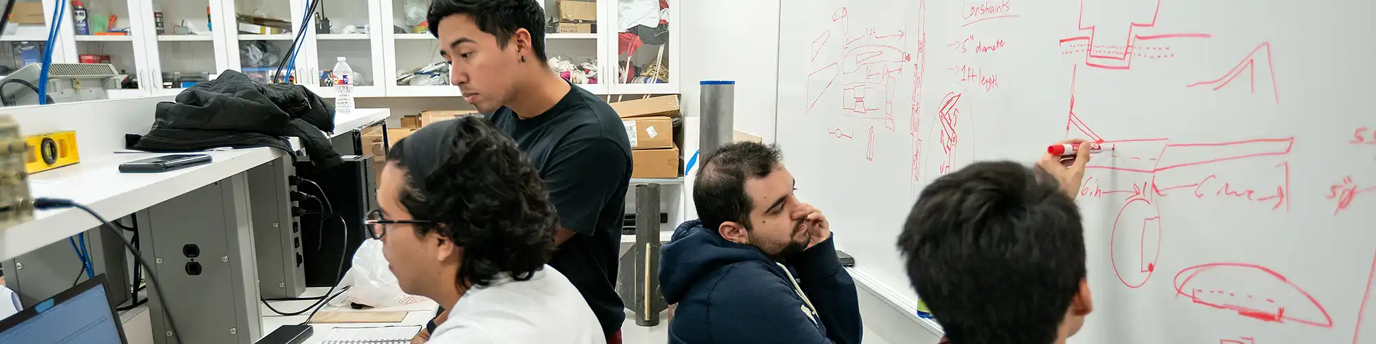 Four students working on a project