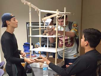 Three students building a prototype.