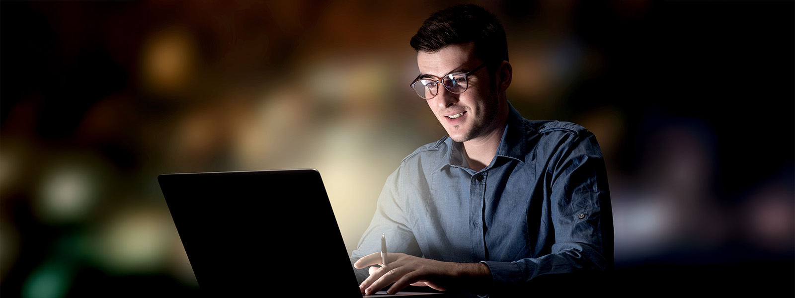 Educational Technology Professional on a Laptop