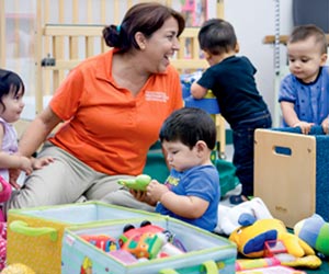 Teacher overseeing students on floor